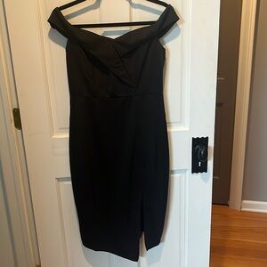 Brand new black dress with sleeves that can be worn off the shoulder.